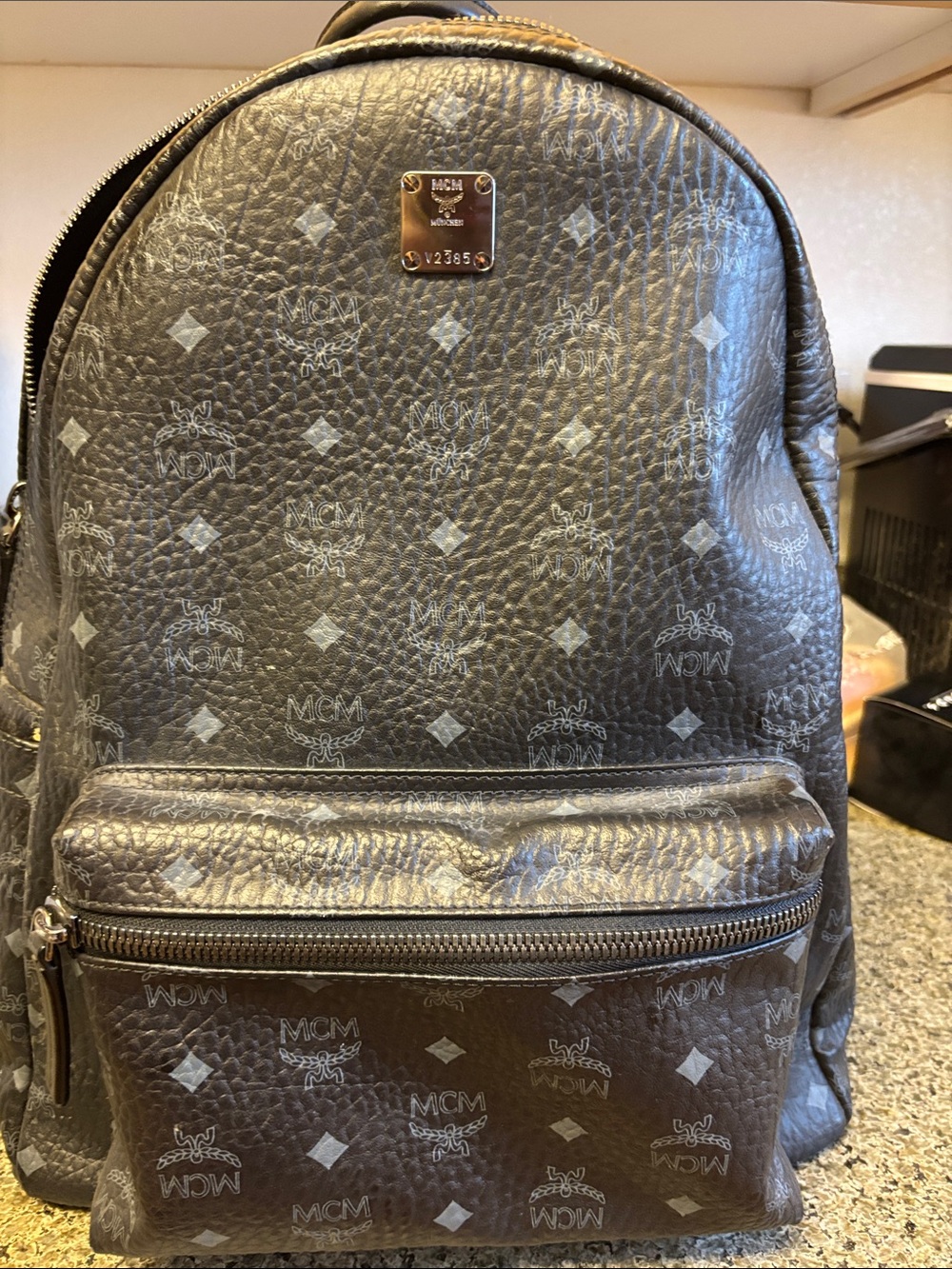 MCM Black Logo-Print Leather Backpack with Silver Plaque